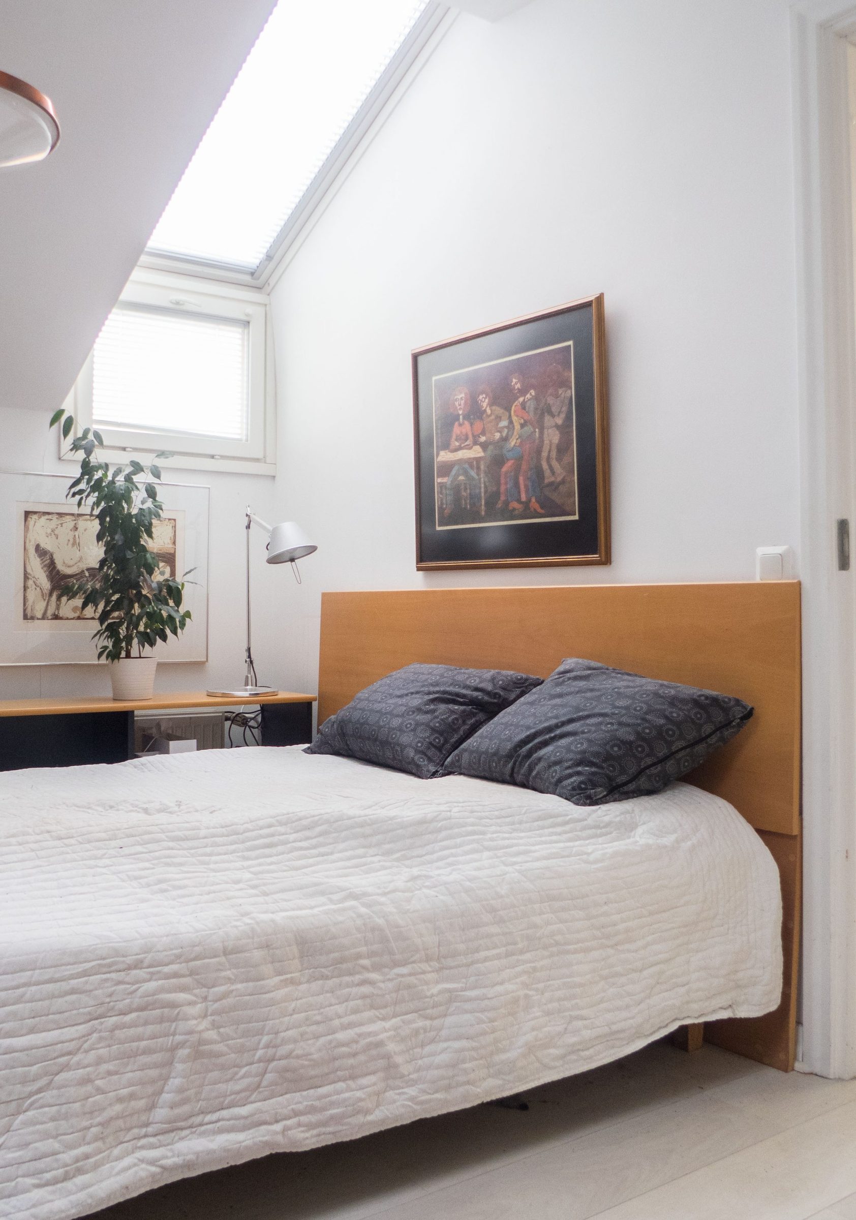 Daylight from the skylight falling down the bedroom wall