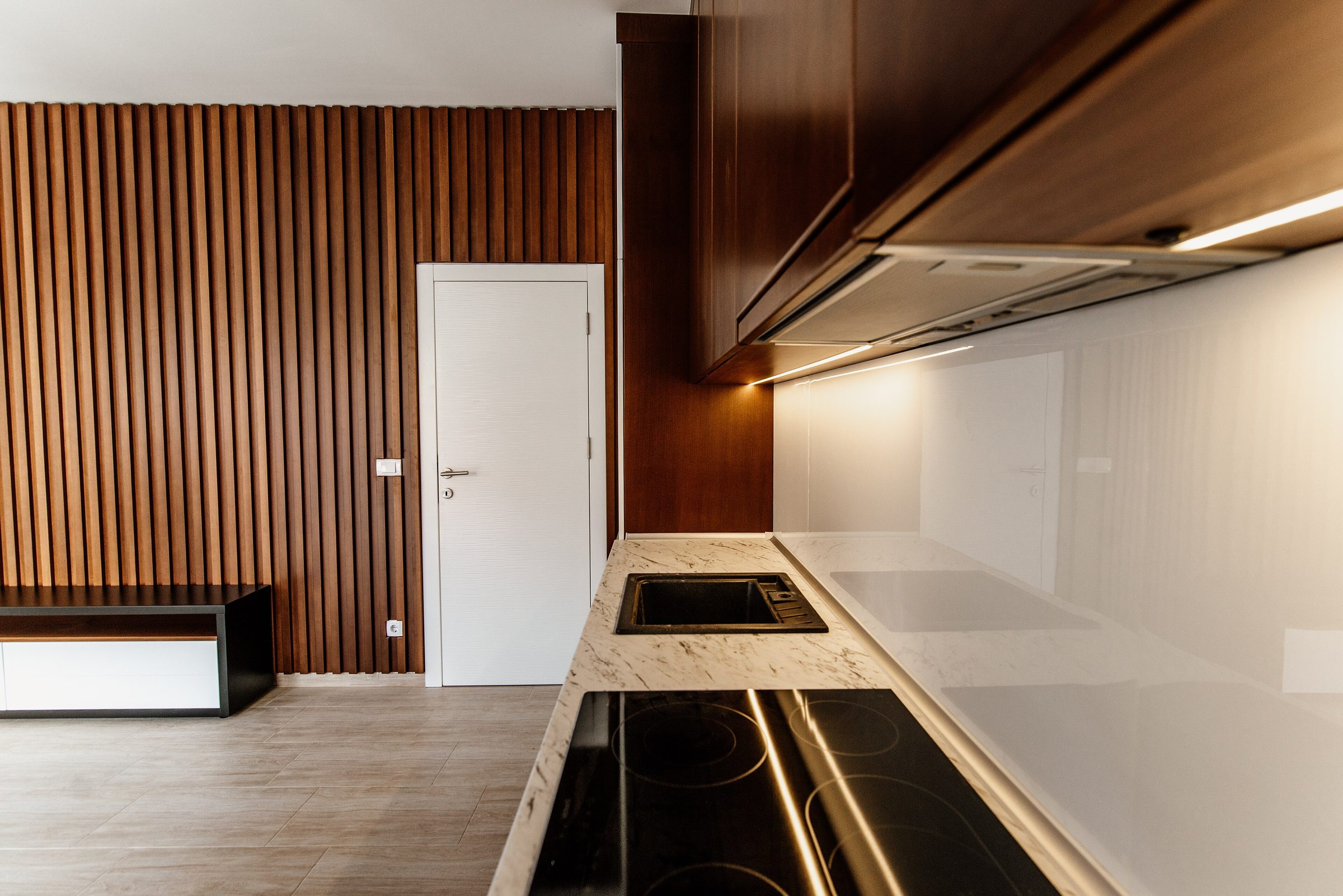 The kitchen run in dark oak against the workshop wall