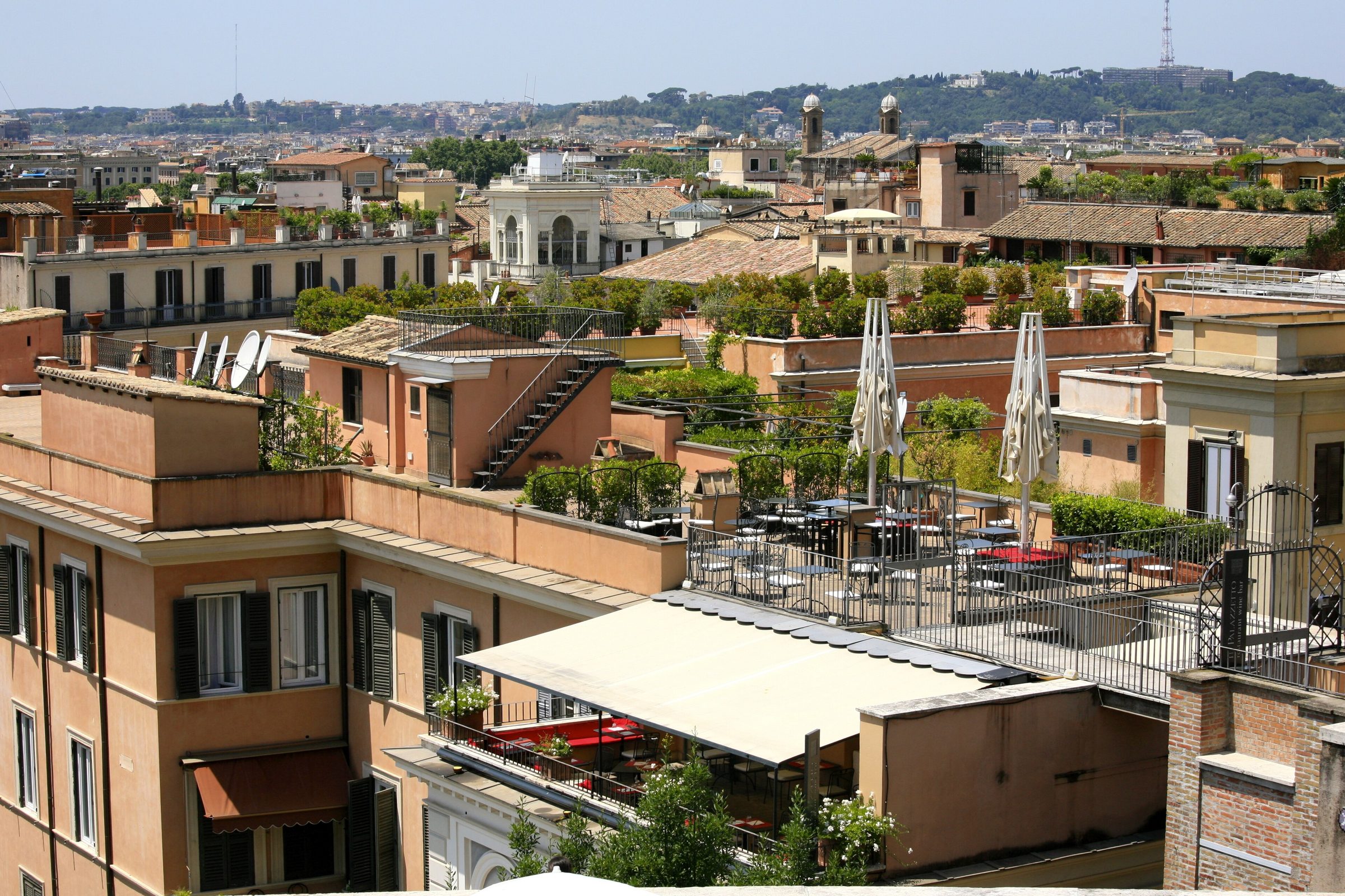 Rooftop terraces and chimneys against the sky